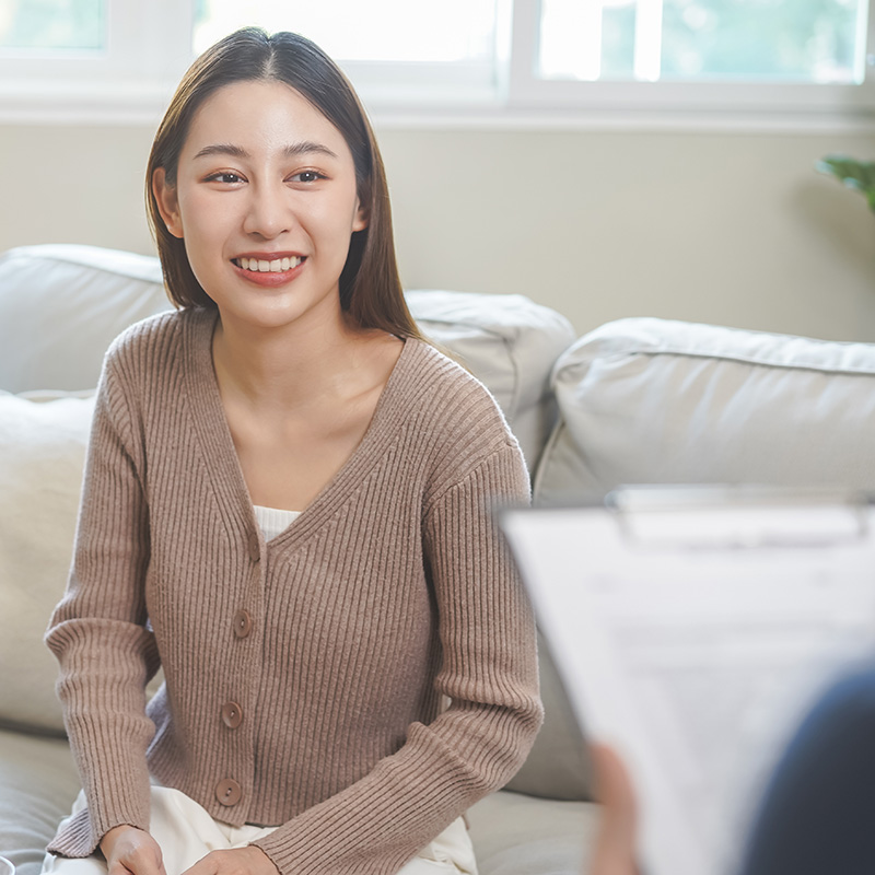 psychiatric_assessment_fargo_nd Asian woman on a couch for a psychiatric assessment